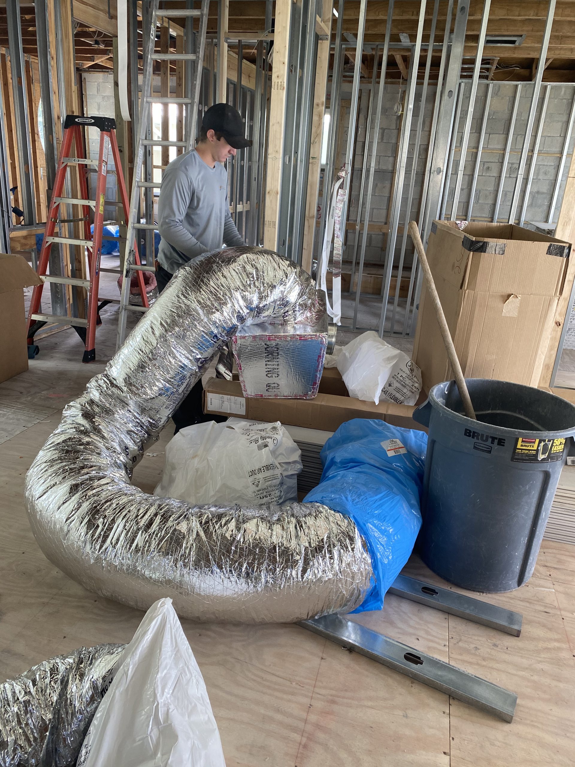 New flexible ductwork install by Brown Mechanical Services Air Conditioning Service experts installing new flexible ductwork in a new home.